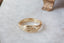 A fantasy inspired wide flower signet band with hand-carved lavender cast in 10 karat yellow gold with a soft brushed finish. An antique style lavender protection ring.
