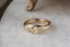 A wide flower signet band with hand-carved lavender shown in 10 karat yellow gold