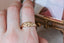 An antique inspired lavender flower signet band. Ready to ship in 10 karat yellow gold with a soft brushed finish.
