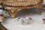 Fantasy elven alternative engagement ring designed and crafted by The North Way Studio. This ready to ship fairytale engagement ring features a diamond halo, a blue princess cut sapphire center, and hand-carved leaves and vines in reclaimed 18 karat white gold.