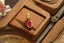 A natural oval ruby Hag Stone pendant in reclaimed 14 karat yellow gold by The North Way Studio. 