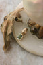 The Hag Stone pendant in reclaimed 10 karat yellow gold and .64 carat natural green sapphire. 