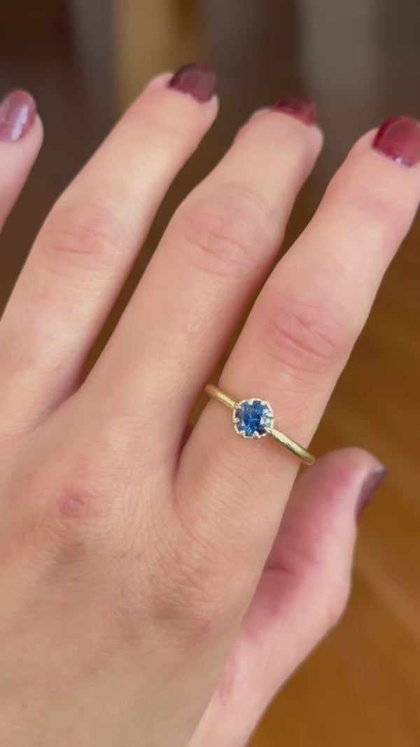 The Iseult ring in natural deep blue Montana sapphire and whittled 18 karat yellow gold.