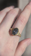 The Spire Signet Heirloom Setting shown in a video on the hand with natural oval brilliant cut diamond. 