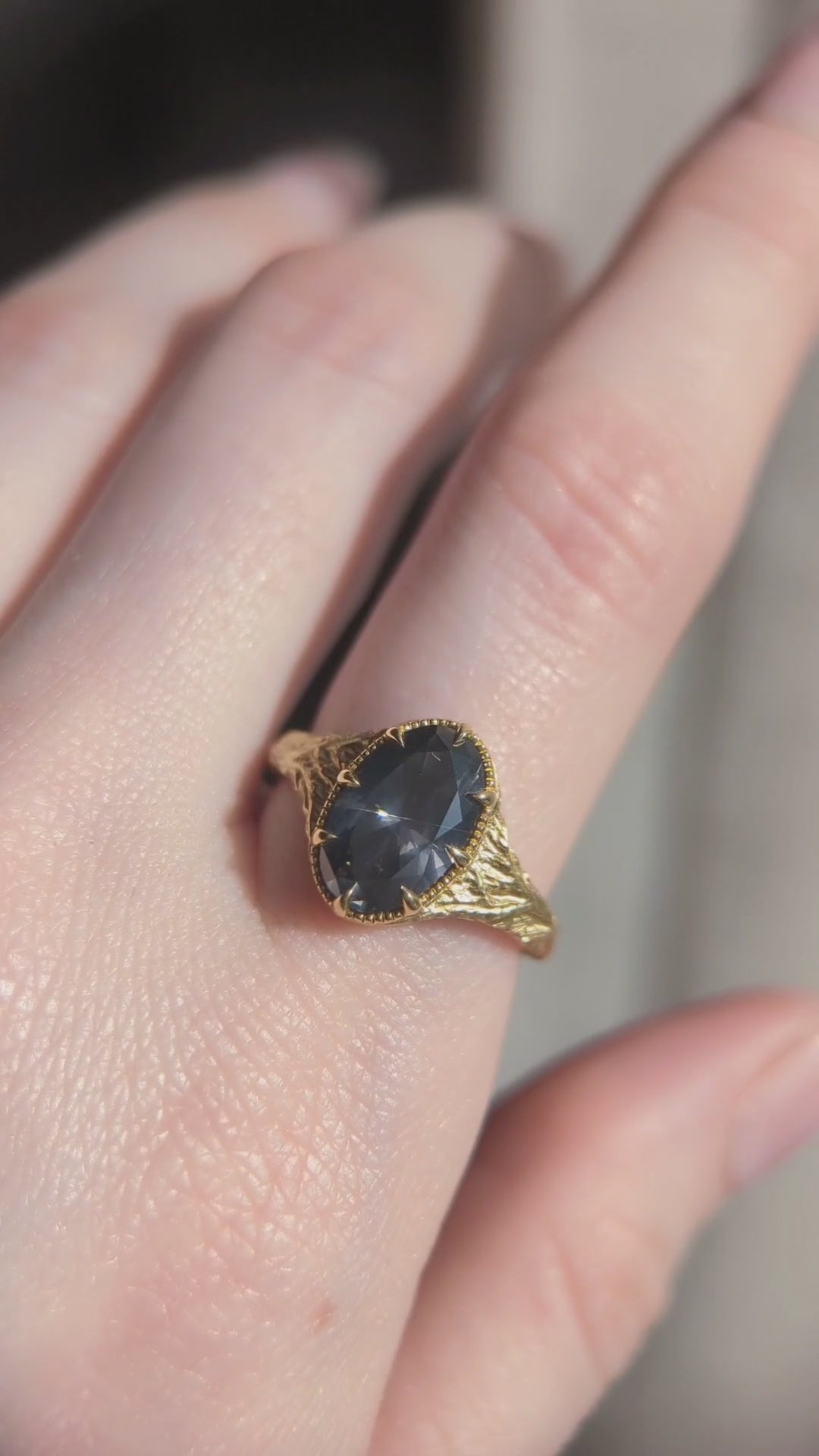 The Spire Signet Heirloom Setting shown in a video on the hand with natural oval brilliant cut diamond. 