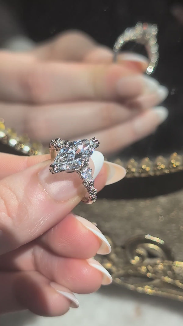 A video of the Belladonna En Trois in marquise brilliant cut diamond by The North Way Studio.