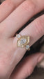 The Hidden Gate En Trois in lab grown oval brilliant cut diamonds shown upon the hand by The North Way Studio. 
