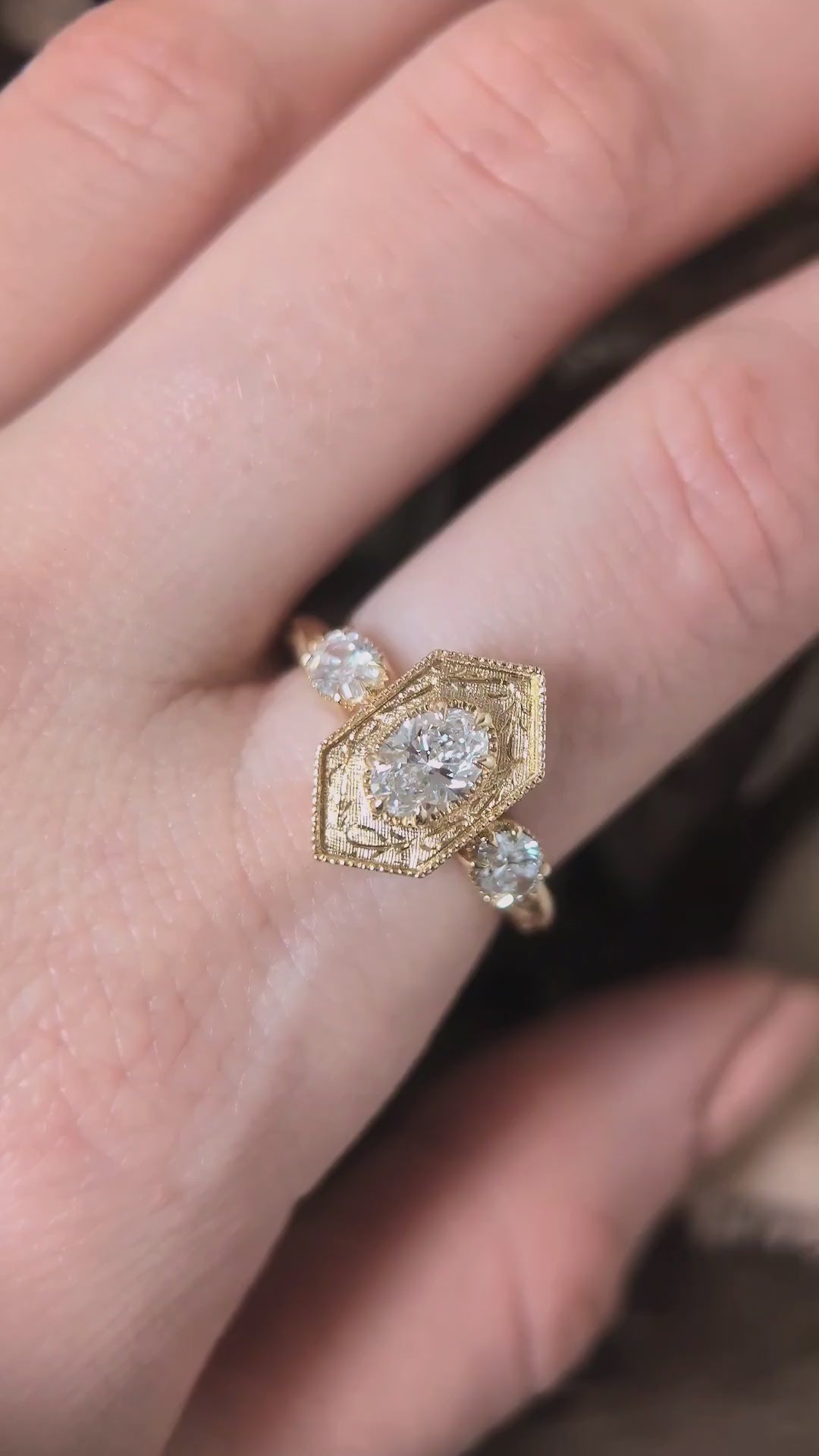 The Hidden Gate En Trois in lab grown oval brilliant cut diamonds shown upon the hand by The North Way Studio. 
