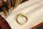 The Spire Signet in reclaimed 18 karat yellow gold and natural marquise cut Canadian diamond center. Set east to west with medieval-inspired leaves.