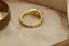 The Spire Signet in reclaimed 18 karat yellow gold and natural marquise cut Canadian diamond center. Set east to west with medieval-inspired leaves.