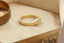 The Spire Signet in reclaimed 18 karat yellow gold and natural marquise cut Canadian diamond center. Set east to west with medieval-inspired leaves.