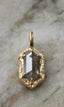 The Spire pendant shown in reclaimed 14 karat yellow gold with an elongated hexagon salt and pepper diamond. Create your own Spire Pendant with any jewel and gold of your choosing. 