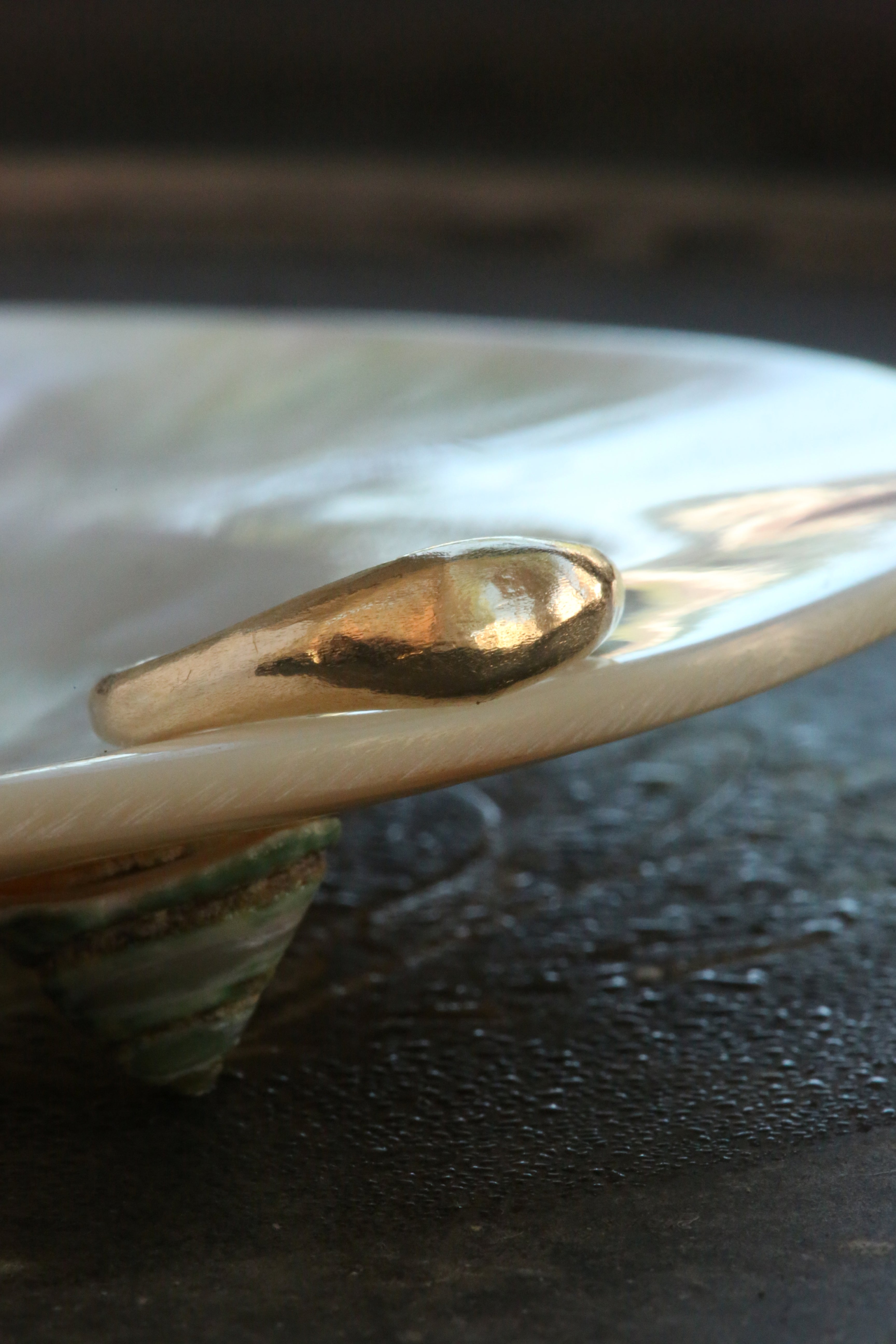 A 14 karat yellow gold signet band with ancient texture. 