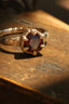 A resplendent being of light, the Utopia Heirloom Setting by The North Way Studio. Carved bark band and tapered leaf prongs, with a hidden world of carved vines and leaves on the setting walls. Shown in reclaimed 14 karat yellow gold and garnet. 

Create your own ring by using this listing to customize. 