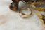 A 14 karat yellow gold ring with opalescent natural diamond in a signet style. 