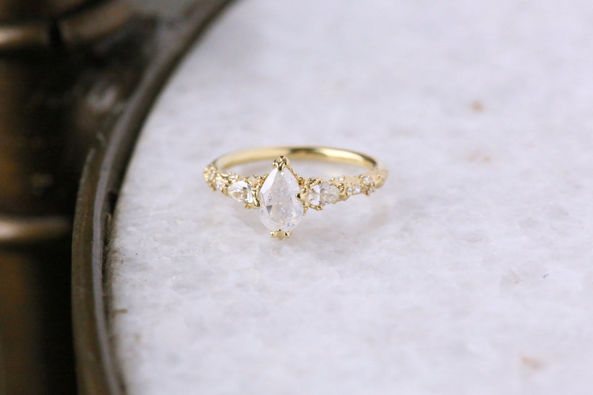 The Belladonna En Trois Ring in Natural Opalescent Diamond