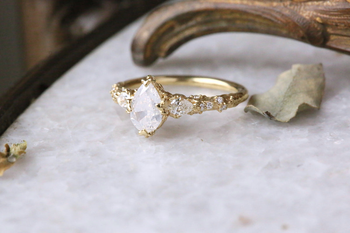 The Belladonna En Trois Ring in Natural Opalescent Diamond